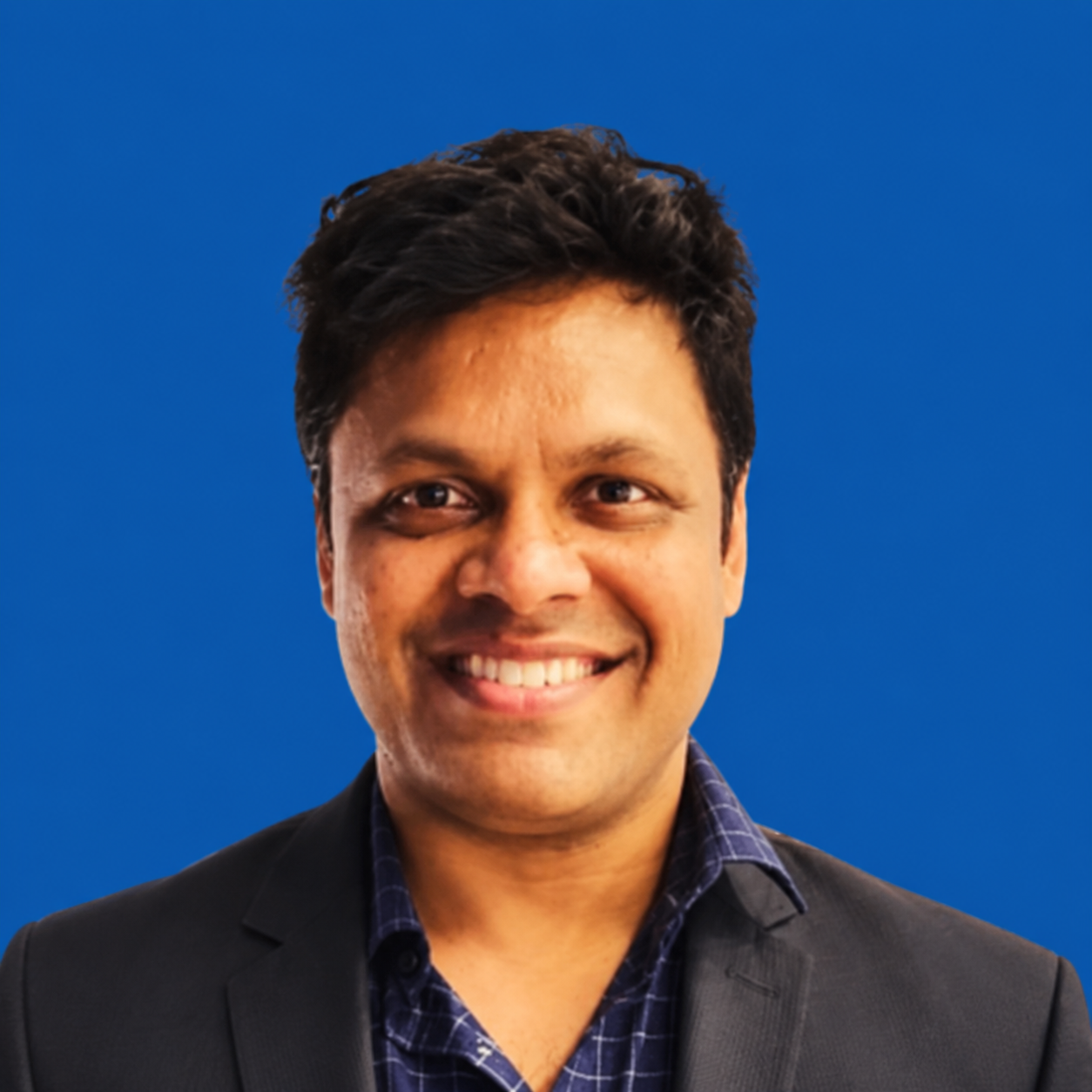 Smiling Professional Headshot on Blue
